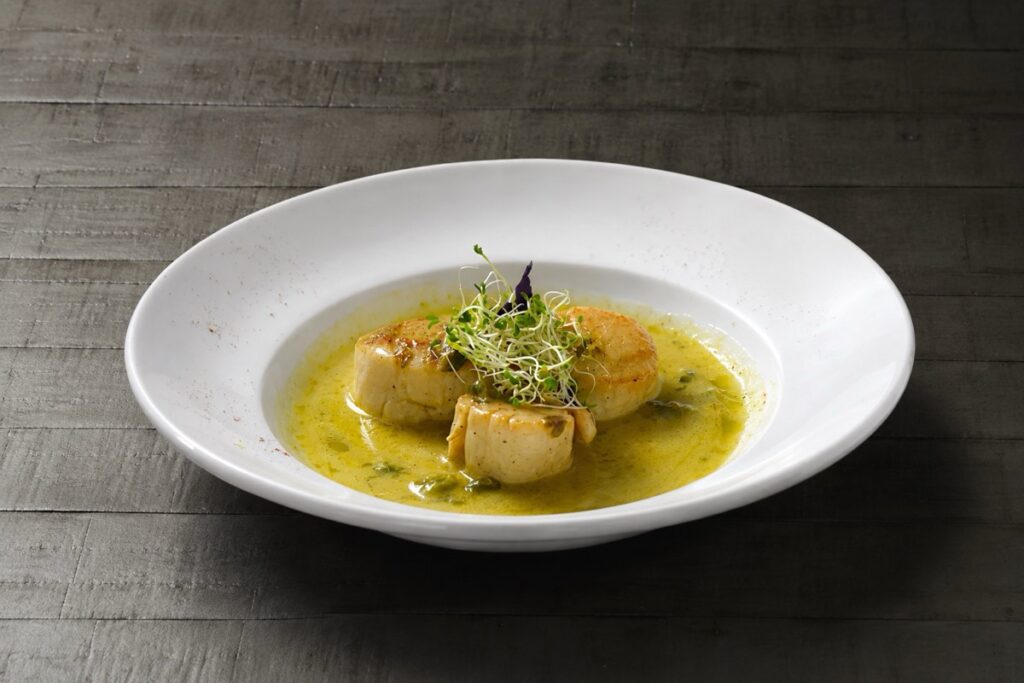 Pan-seared scallops in a lemon beurre blanc sauce