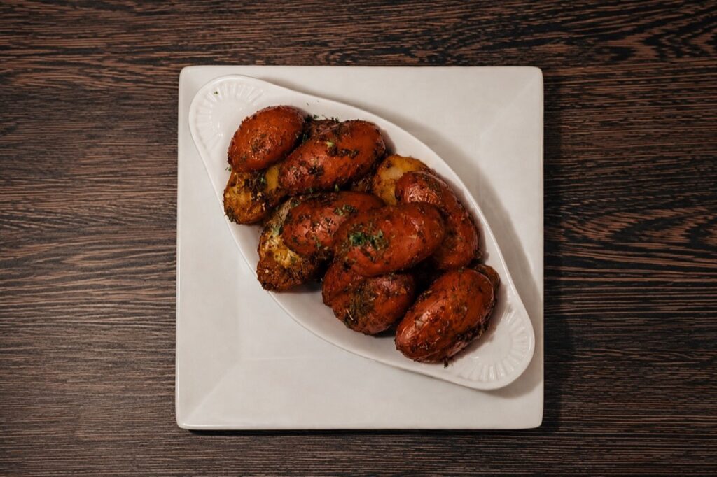 A plate of crispy roasted potatoes